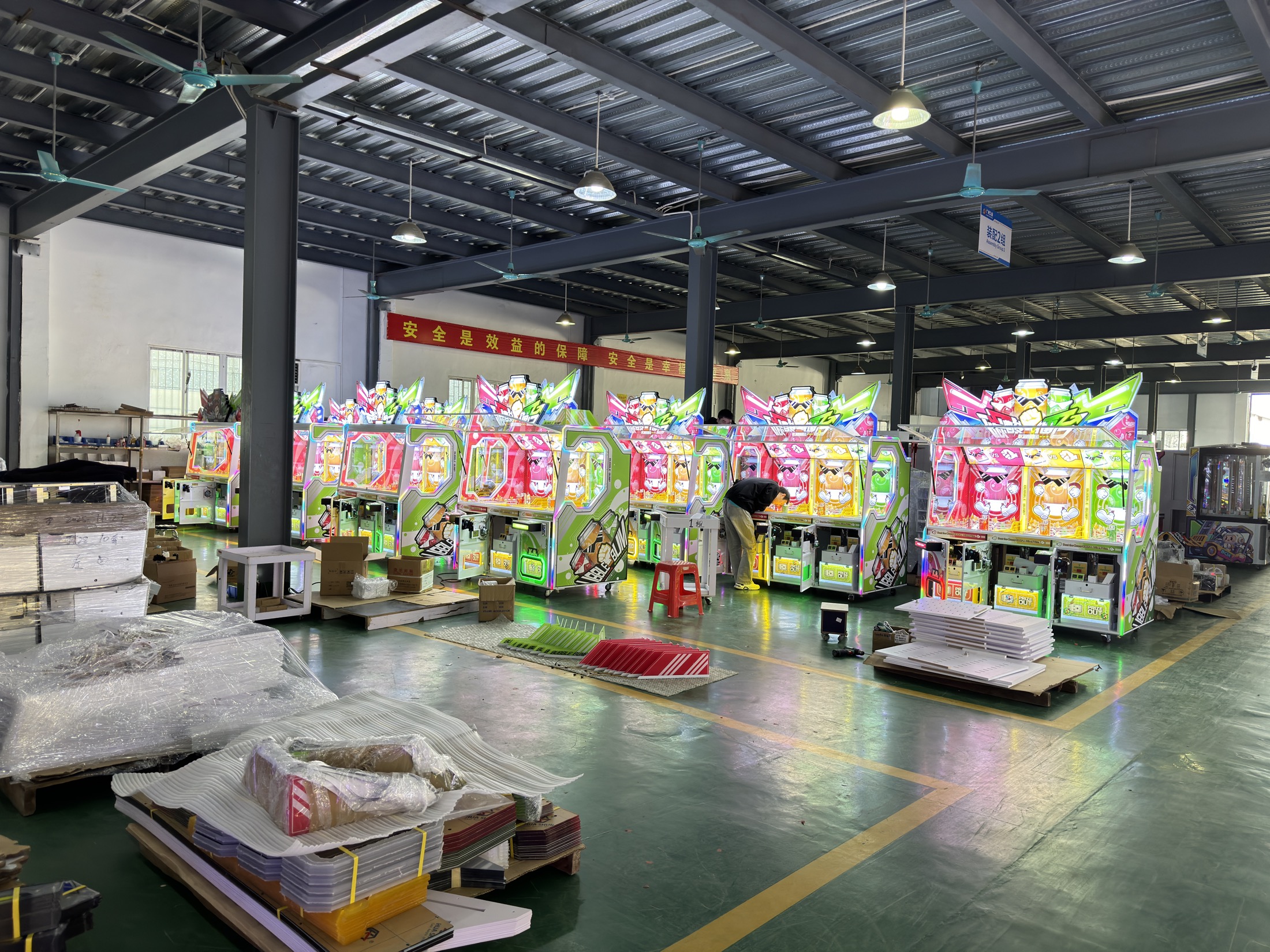 Wide view of Jiuyou arcade machine production floor in Guangzhou