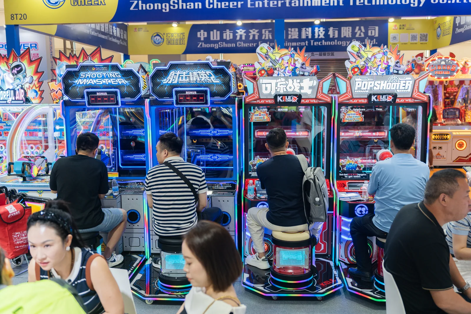 Visitors testing arcade machines at GTI China Expo 2025 in Guangzhou