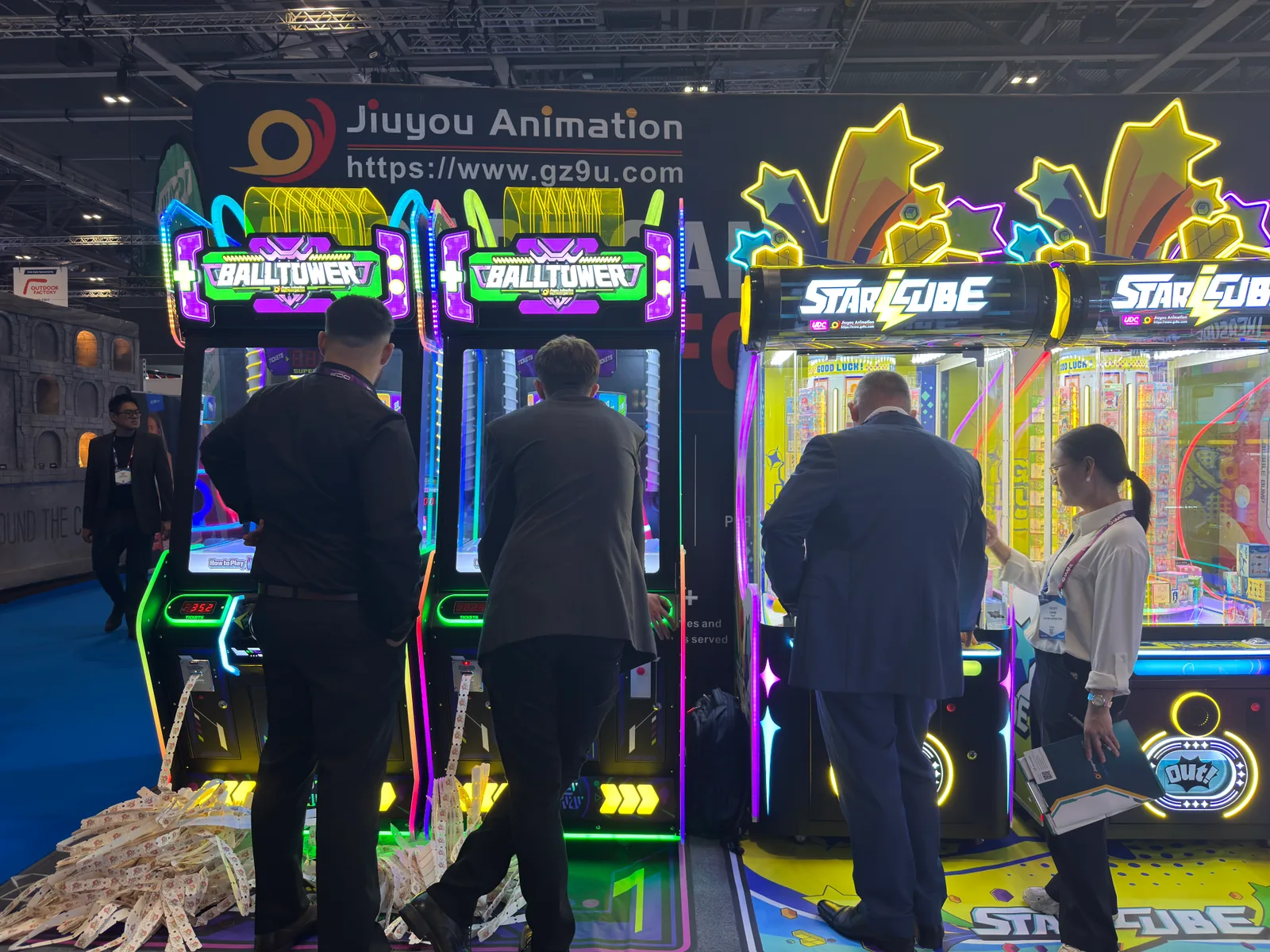 Visitors trying Ball Tower beside the Star Cube machines