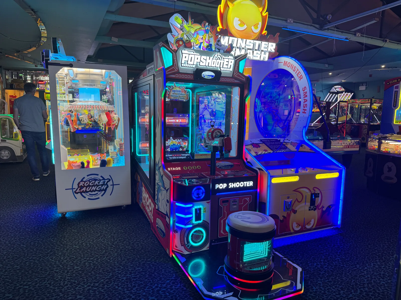 Pop Shooter positioned alongside other machines on an arcade floor